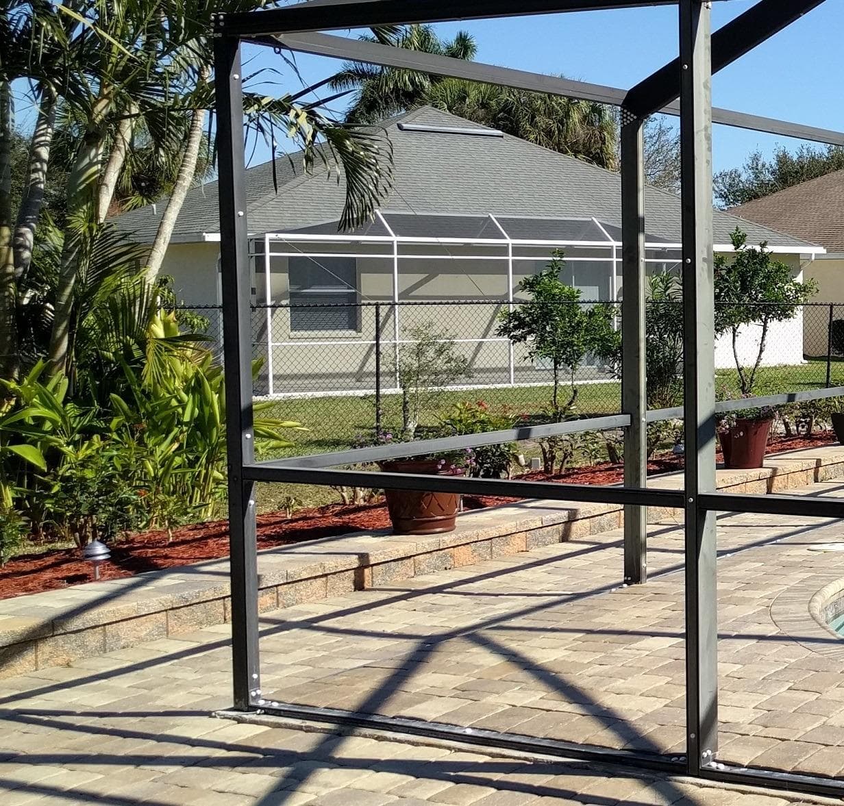 Pool enclosure frame prepared for new screen installation