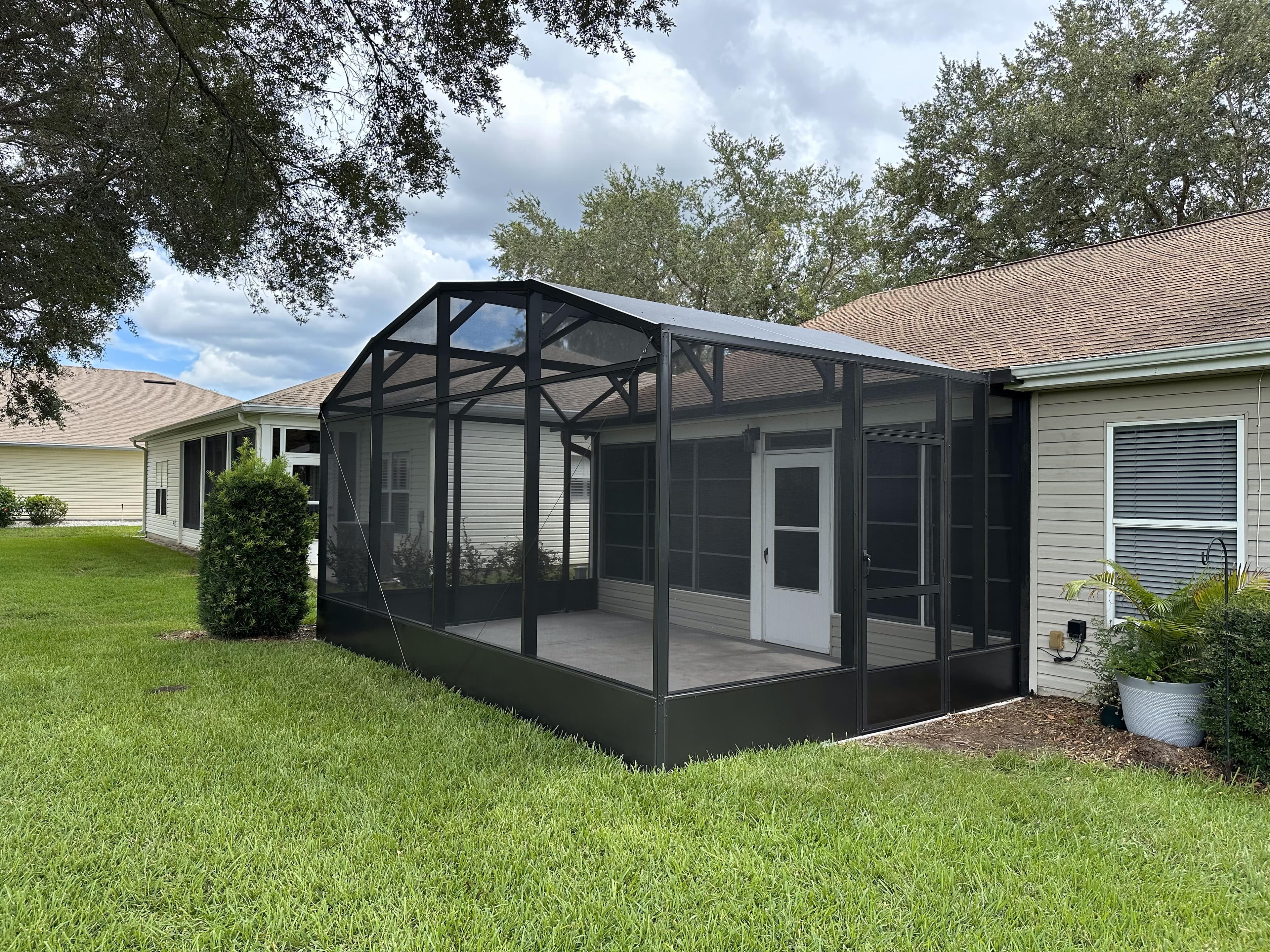 Exterior view of a residential pool screen enclosure
