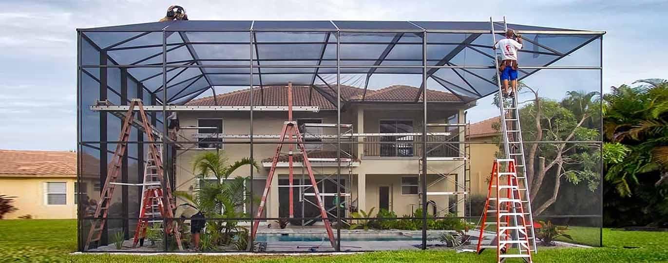 Pool screen enclosure repair project with ladders set for access