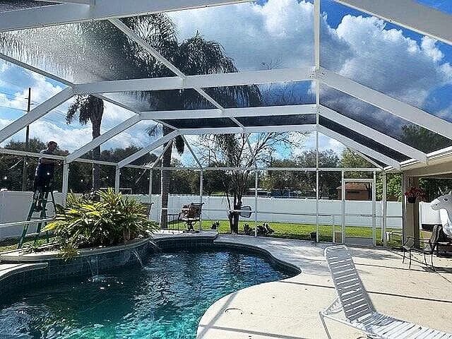 Roof screen repair work on a pool enclosure